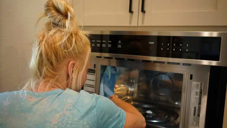 Simply Maid cleaner detailing the inside of a wall oven